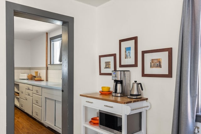 hall featuring dark wood-style flooring