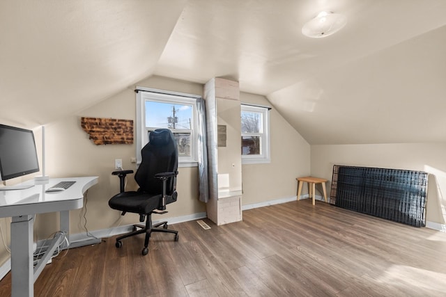 home office with lofted ceiling, baseboards, and wood finished floors