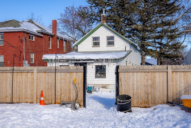 snowy yard with fence