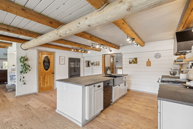 kitchen with black dishwasher, light wood-style floors, dark countertops, and white cabinets