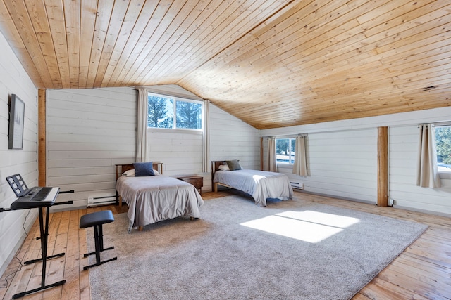 unfurnished bedroom featuring wooden ceiling, a baseboard radiator, wooden walls, light wood-style floors, and vaulted ceiling