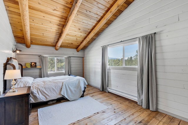 bedroom featuring wood ceiling, vaulted ceiling with beams, light wood-style flooring, and baseboard heating