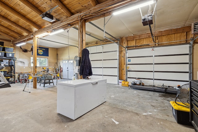 garage featuring a garage door opener and refrigerator