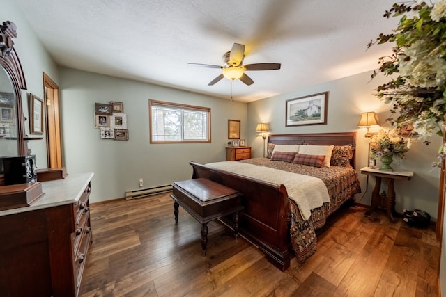 bedroom with ceiling fan, a baseboard radiator, wood-type flooring, and a textured ceiling