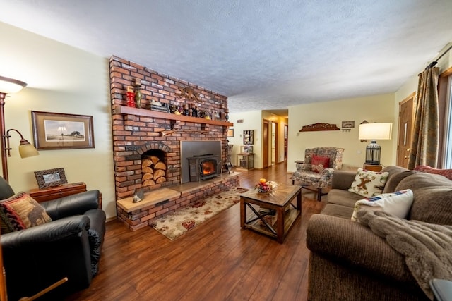 living room with a textured ceiling and wood finished floors