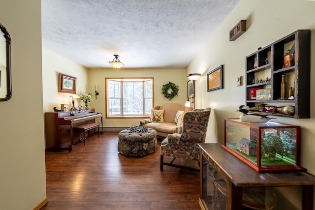 living area with a textured ceiling and dark wood finished floors