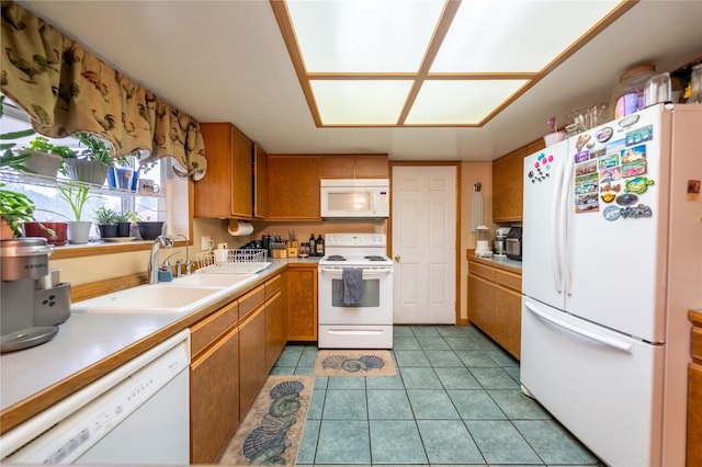 kitchen featuring light countertops, white appliances, and brown cabinetry