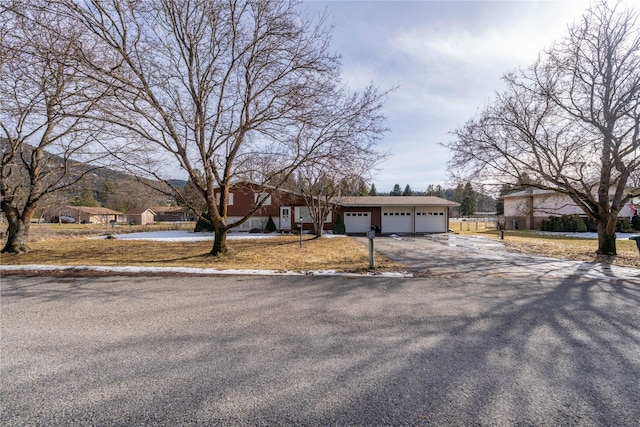 view of front of home with a garage and a residential view