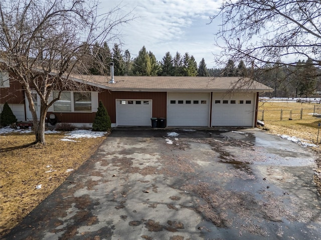 view of front of home featuring driveway and an attached garage