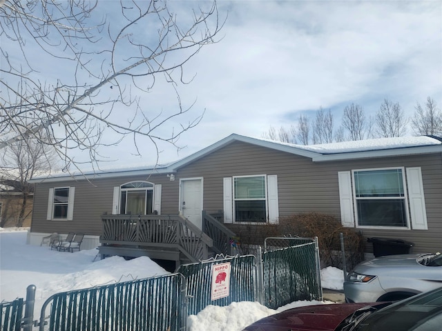 manufactured / mobile home with a fenced front yard