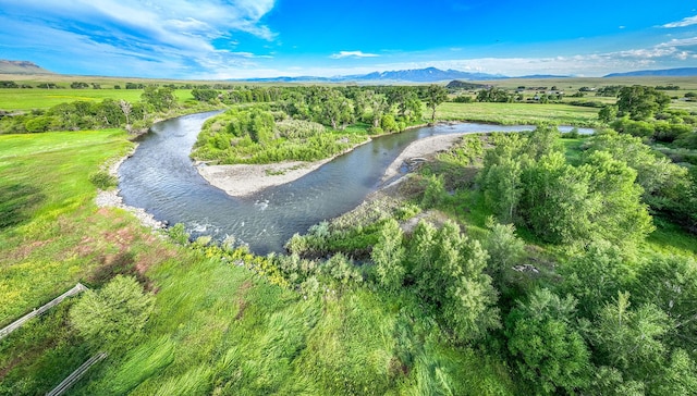 aerial view featuring a water and mountain view