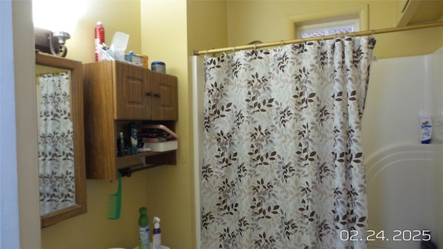 full bath with a shower with curtain