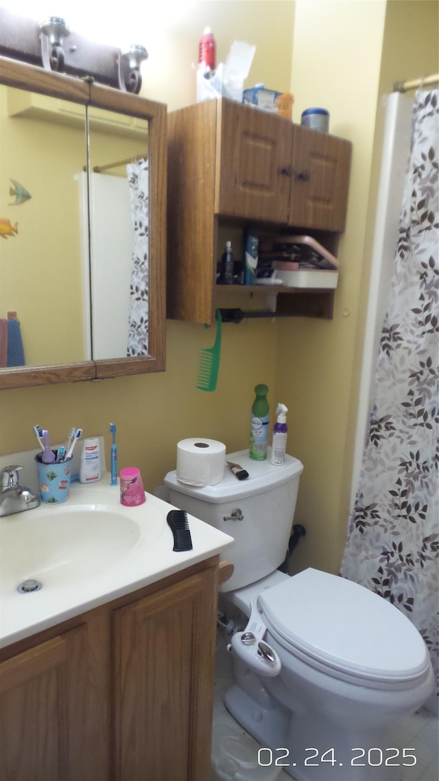 bathroom with vanity and toilet