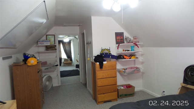 carpeted bedroom with vaulted ceiling