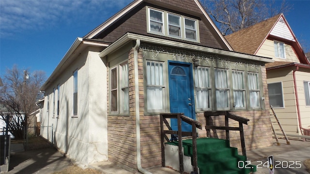 view of property exterior with fence