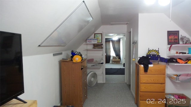 interior space with lofted ceiling and light colored carpet