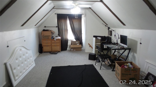 home office featuring light carpet and vaulted ceiling