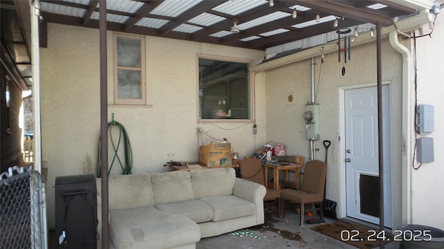 view of patio with fence, outdoor lounge area, and a pergola