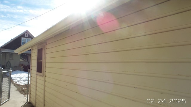 view of home's exterior with fence