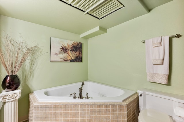 full bathroom featuring visible vents, a garden tub, and toilet