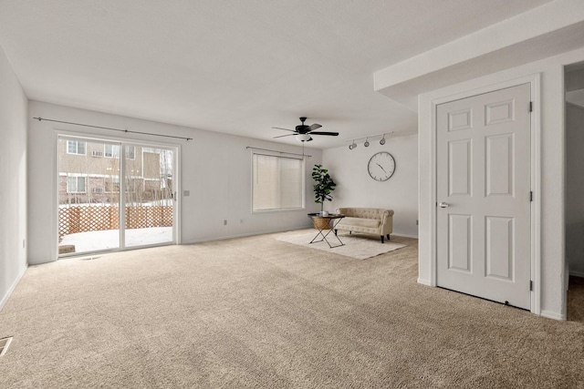 312 Ponderosa St, Kalispell, MT 59901 - unfurnished room featuring carpet floors, a ceiling fan, and track lighting