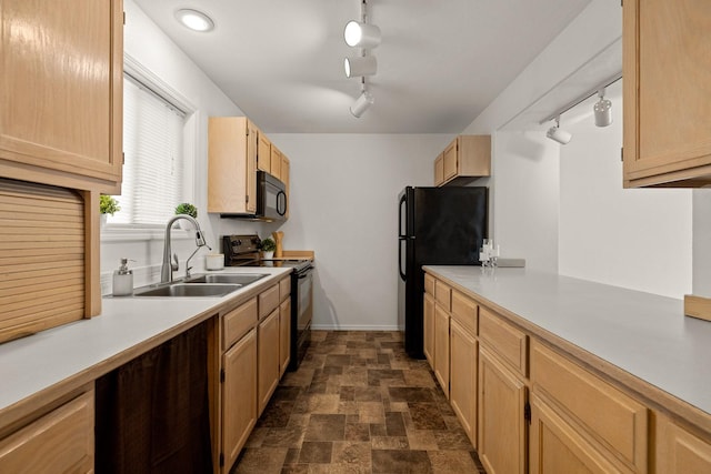 312 Ponderosa St, Kalispell, MT 59901 - kitchen featuring black appliances, track lighting, light countertops, and stone finish flooring