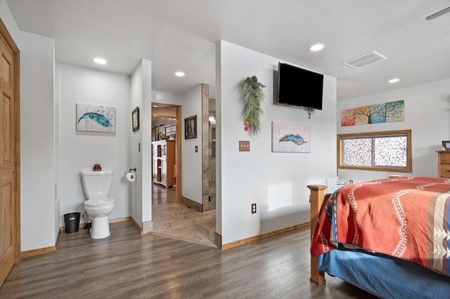 bedroom featuring baseboards, visible vents, dark wood finished floors, and recessed lighting