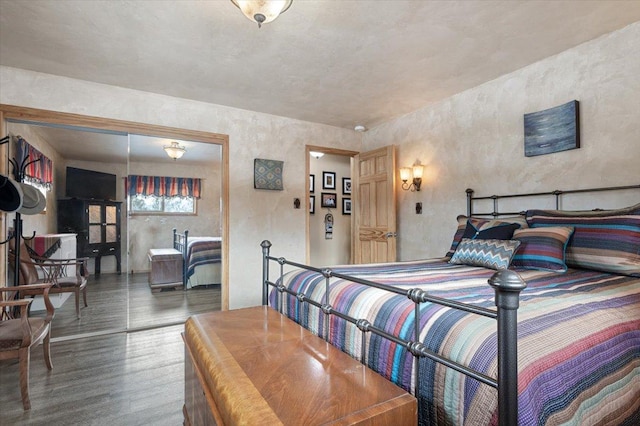 bedroom with wood finished floors