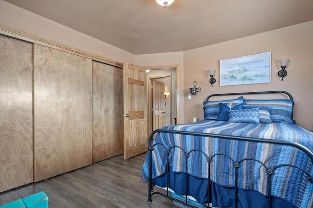 bedroom with a closet and wood finished floors