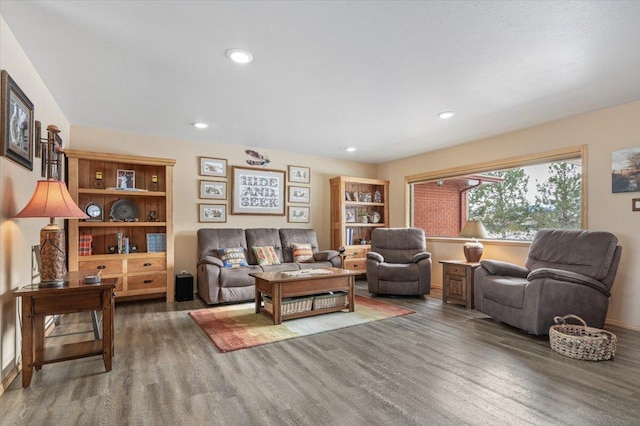 living room featuring dark wood finished floors and recessed lighting