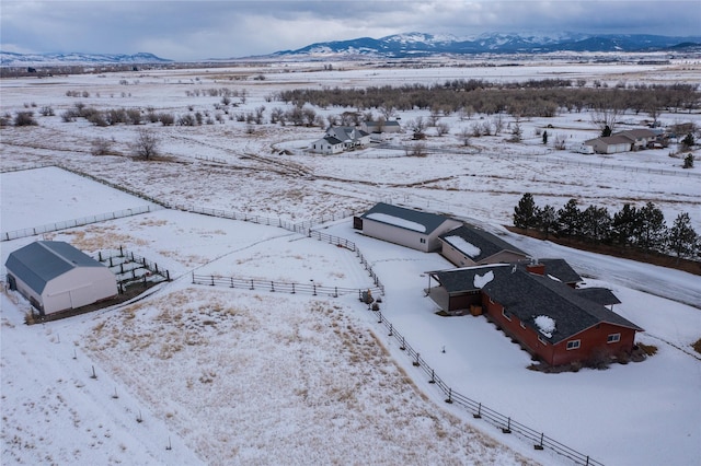 snowy aerial view featuring a mountain view