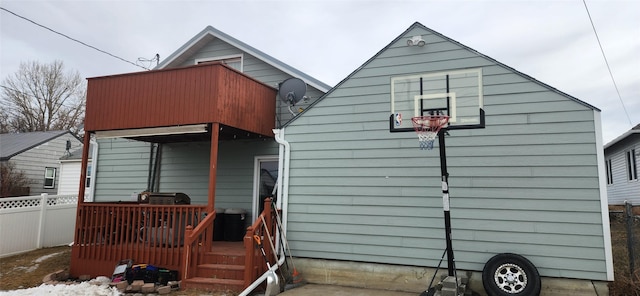 rear view of house with fence