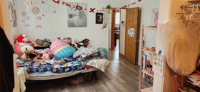 bedroom featuring dark wood-style floors