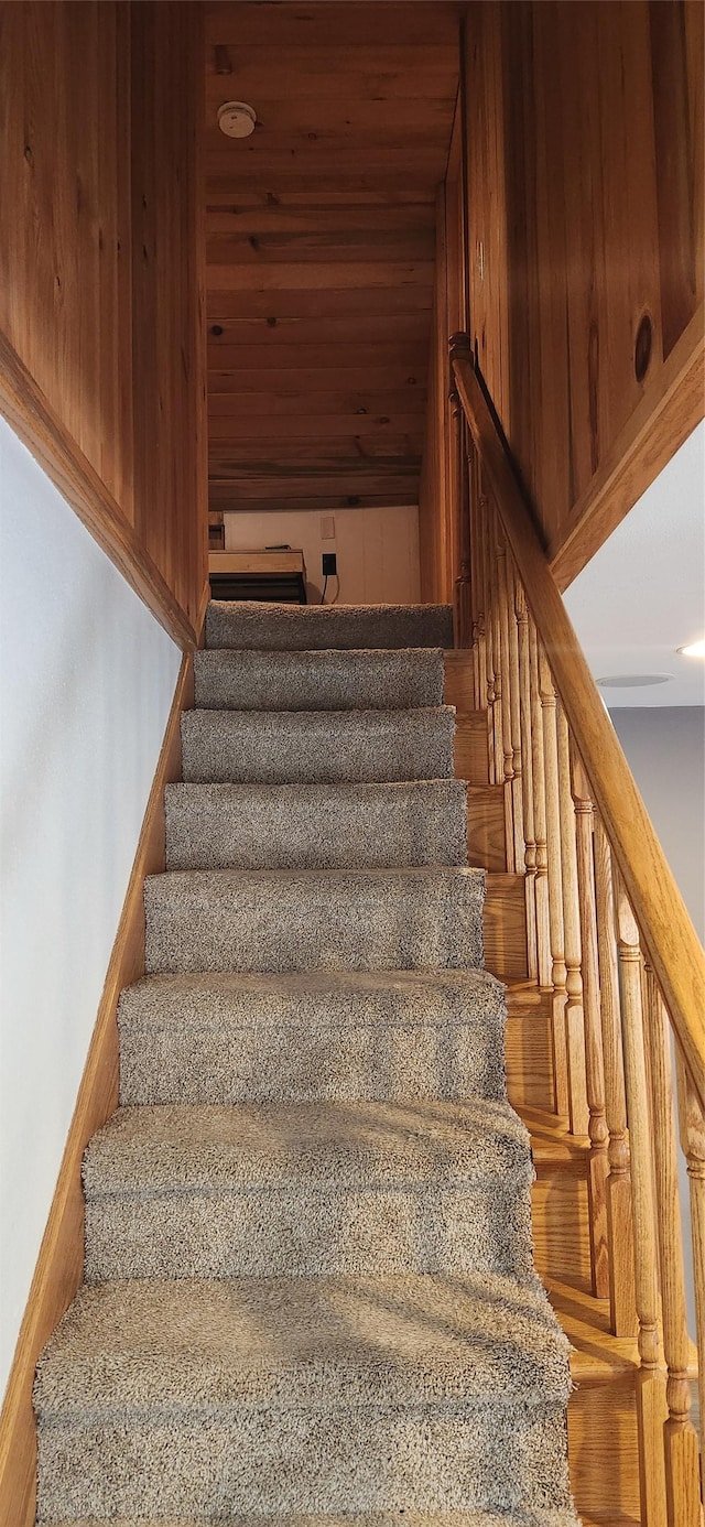 staircase with wood ceiling