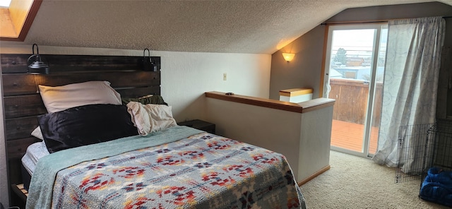 carpeted bedroom with a textured ceiling and vaulted ceiling