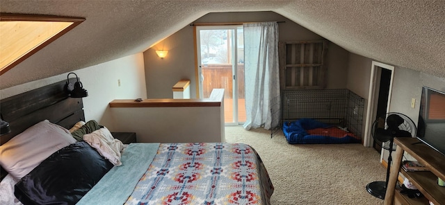 bedroom featuring carpet, vaulted ceiling, and a textured ceiling