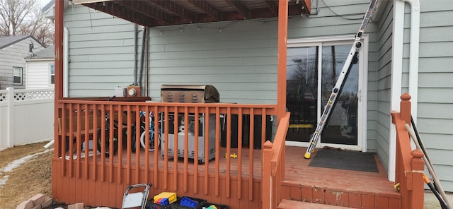 wooden deck featuring fence