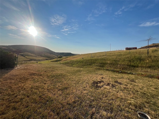 view of mountain feature with a rural view