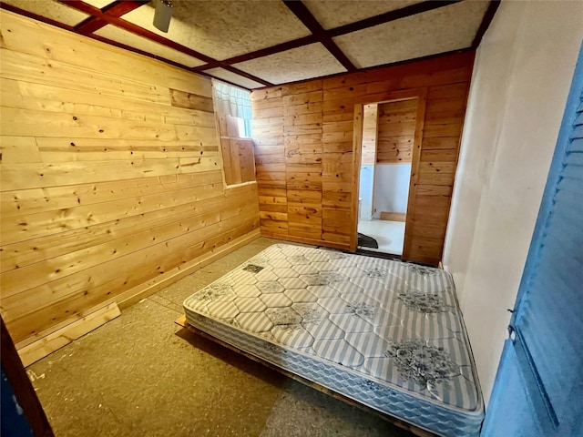 unfurnished bedroom with wood walls