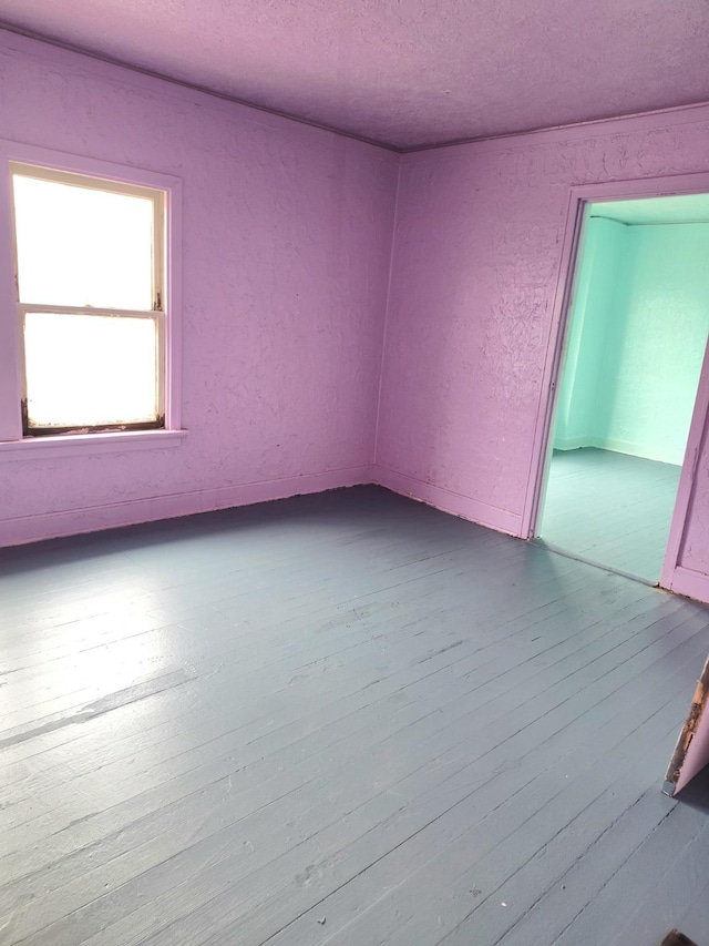 unfurnished room with light wood-style floors