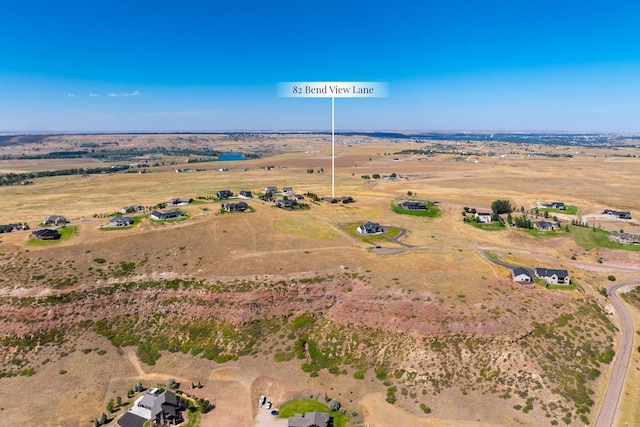 birds eye view of property featuring a rural view