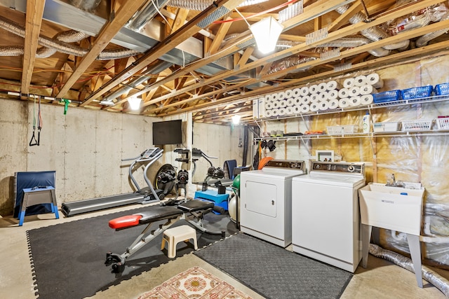 interior space with separate washer and dryer and a sink