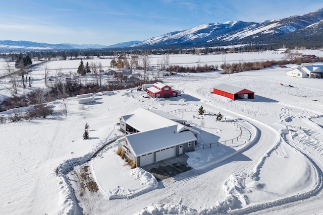 snowy aerial view with a mountain view