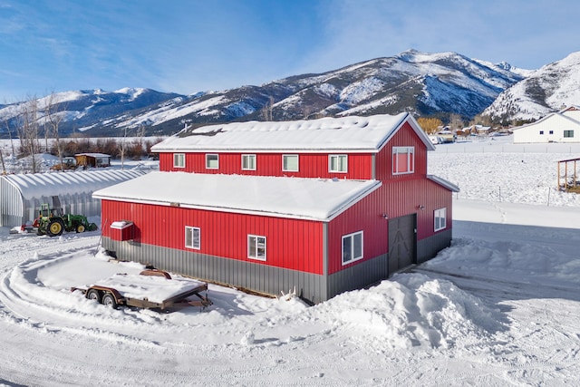 exterior space featuring a garage and a mountain view