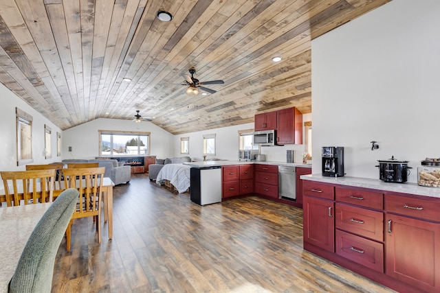 kitchen featuring stainless steel appliances, light countertops, wood ceiling, open floor plan, and dark brown cabinets