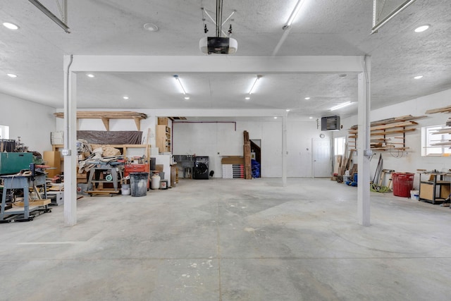 garage featuring a workshop area and a garage door opener