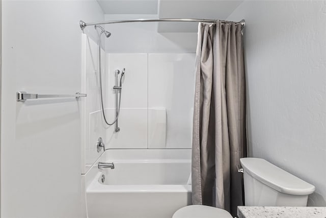 bathroom with shower / bath combination with curtain and toilet