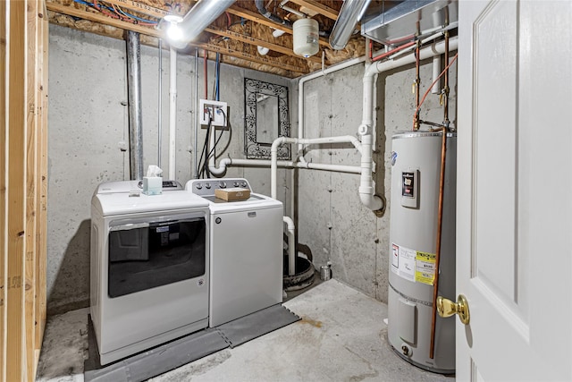 clothes washing area with laundry area, secured water heater, and washer and clothes dryer