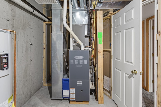 utility room featuring water heater and heating unit