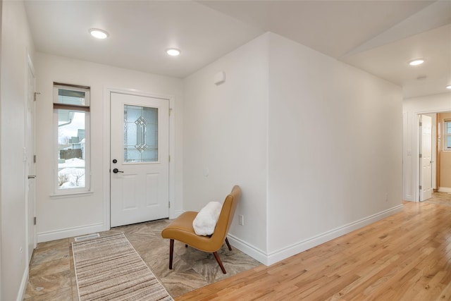 entrance foyer with recessed lighting, visible vents, light wood finished floors, and baseboards